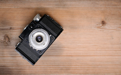 retro camera on wooden background