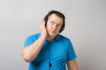Fototapeta premium man listens music with headphones