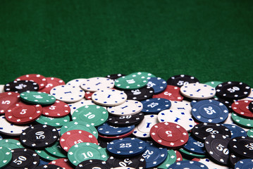 Casino chips on a green table background