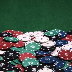 Casino chips on a green table background