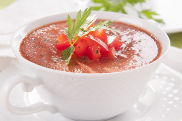 tomato soup in a white bowl
