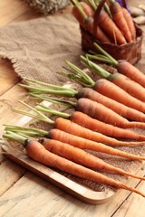 Fresh carrots on the wood background