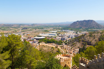 Fototapeta na wymiar Historical town of Xativa, Valencia region, Spain. Spectacular areal view from the Castle of Xativa. The ancient castle is located on the top of the mountain near the town of Xativa.