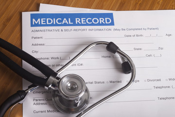 Medical insurance records and Stethoscope - 88440904