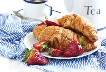 Fresh croissants and cup of tea