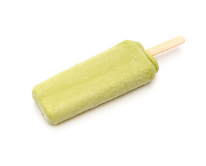 green popsicle on a white background