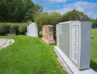 memorial monuments shown in a variety of different colored granite