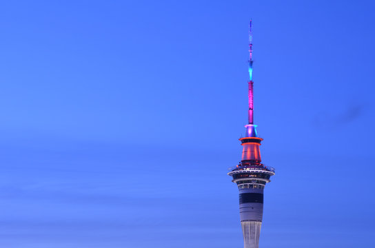 Aerial view of Auckland Sky tower in colors at dusk
