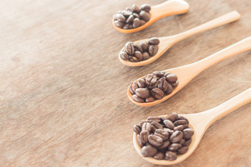 Coffee spoons on grunge wooden table