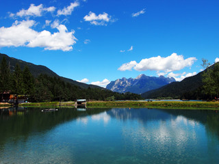 Fototapeta na wymiar The Tudaio mountain and the Center Cadore lake in the Dolomiti mountains