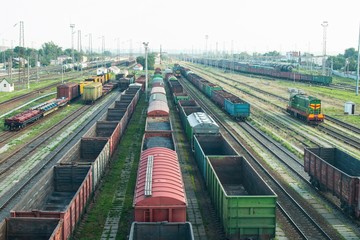 Fototapeta na wymiar Bataysk railway station. Big railway cargo and passengers station junction with lot of trains and track lines. 