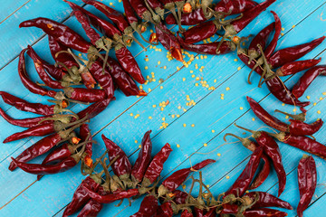 Chili pepper on wooden background; view from above, studio shot