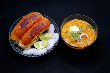 pav bhaji an indian cuisine or dish prepared with crushing mixed vegetables mainly potatoes,tomato,peas and some other green vegetables made spicy and served with butter