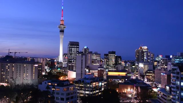 Panoramic view of Auckland Sky tower and the financial center  skyline in colors at dusk