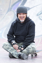 old man skater smiling © click_and_photo