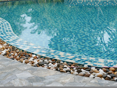 stone on the edge of the swimming pool