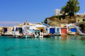 Scenic Mandrakia village (traditional Greek village by the sea) with sirmate - traditional fishermen's houses, Milos island, Cyclades, Greece.