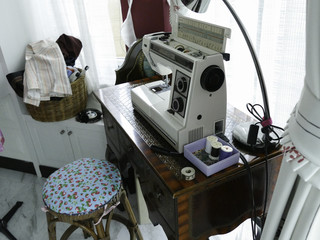 sewing machine on vintage wooden desk