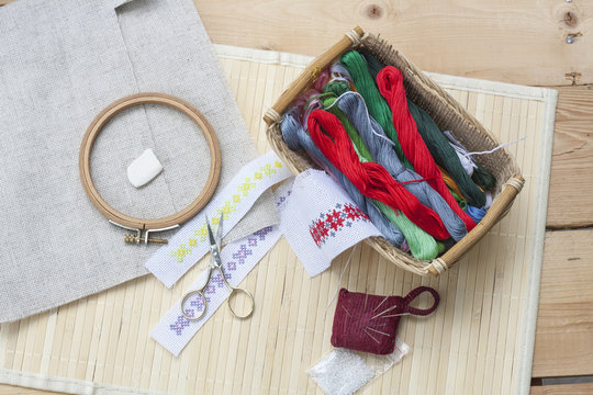 Sewing and ambroidery craft kit, embroidery thread in basket and other tools, selective focus