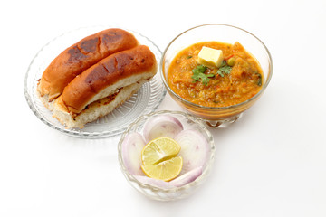 pav bhaji an indian cuisine or dish prepared with crushing mixed vegetables mainly potatoes,tomato,peas and some other green vegetables made spicy and served with butter