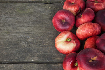 Peaches on a rustic wooden background with excessive space