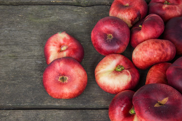 Peaches on a rustic wooden background with excessive space