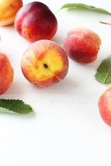 fresh peaches on white boards
