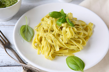 Pasta with basil on a plate
