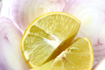 freshly cut onion slices and lemon pieces served as onion salad with indian food