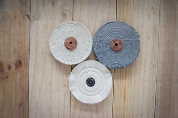 Cloth buffer wheel on the wooden background