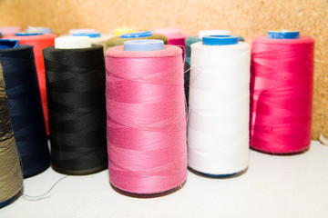 Many reels of  threads standing on the table