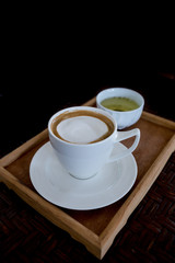 hot cappuccino on black background
