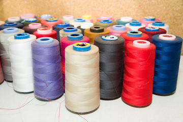 Many reels of  threads standing on the table