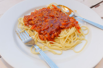 Spaghetti pasta with tomato beef sauce.