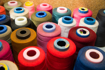 Many reels of  threads standing on the table