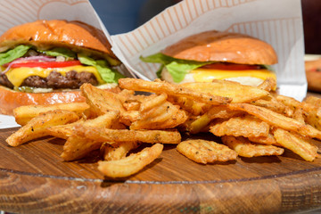 fresh burgers and fries on tray