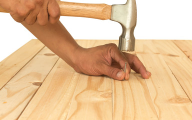 Hammer and nails on wood