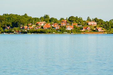 Red cabins by the water
