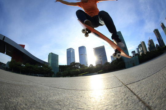  skateboarder skateboarding at sunrise city sunrise city