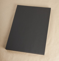 Fototapeta premium Blank flyer poster on cardboard to replace your design.