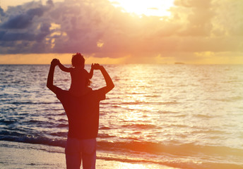 Fototapeta premium father and daughter having fun on sunset sky