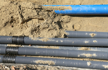 corrugated pipes for laying electric cables in the excavation