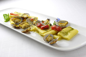 Pasta Dish Paccheri Macaroni with Clams Grilled Tomatoes and Bas