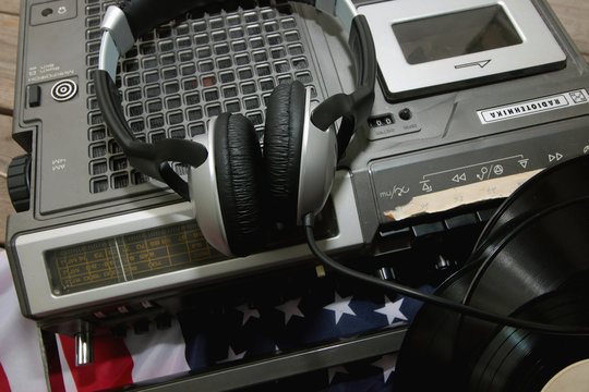 player with headphones on vinyl plates