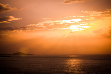 Fototapeta premium Dramatic Sunset on the beach with golden beautiful sky