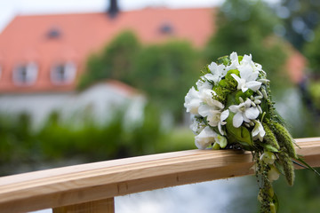 wedding bouquet on bridge