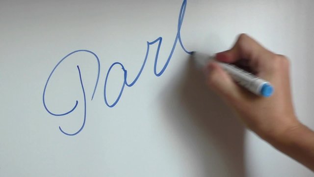 Hand writing and erasing words part ten on white board with blue marker