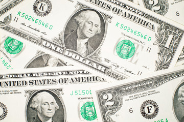 A lot of banknotes one and two US dollars