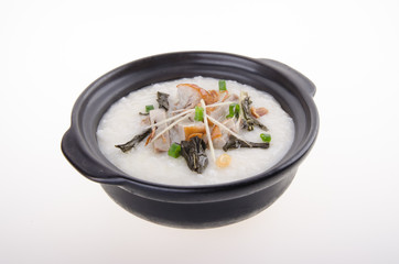 Traditional chinese pork porridge rice gruel served in claypot