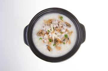 Traditional chinese pork porridge rice gruel served in claypot